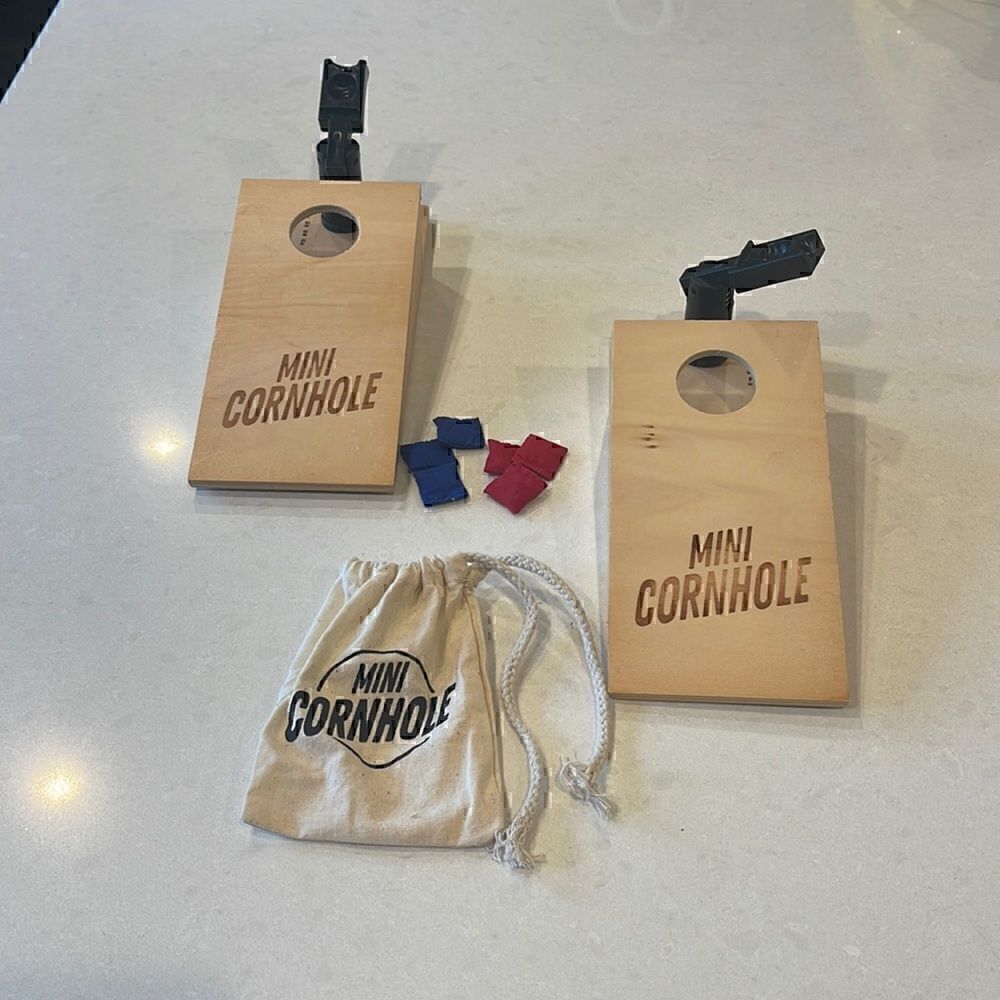 Cornhole mini game, for the kid at heart, shoots  bags quite far,accurately.